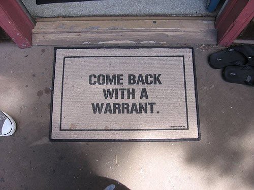 Come back with a warrant doormat emphasizing privacy rights and law enforcement procedures in the United States.